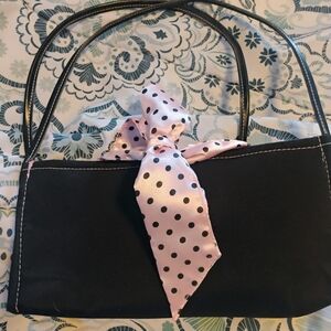 Elegant Black Mini Bag with Pink Polka Dot Accent